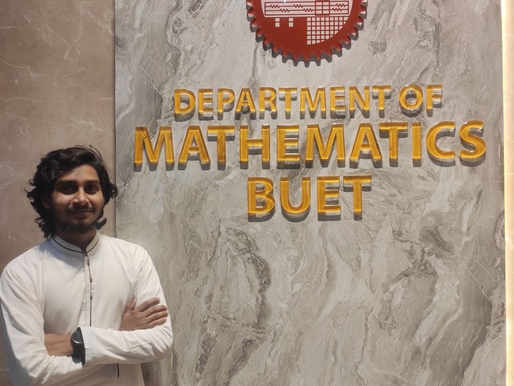Beside the Department of Mathematics sign at BUET